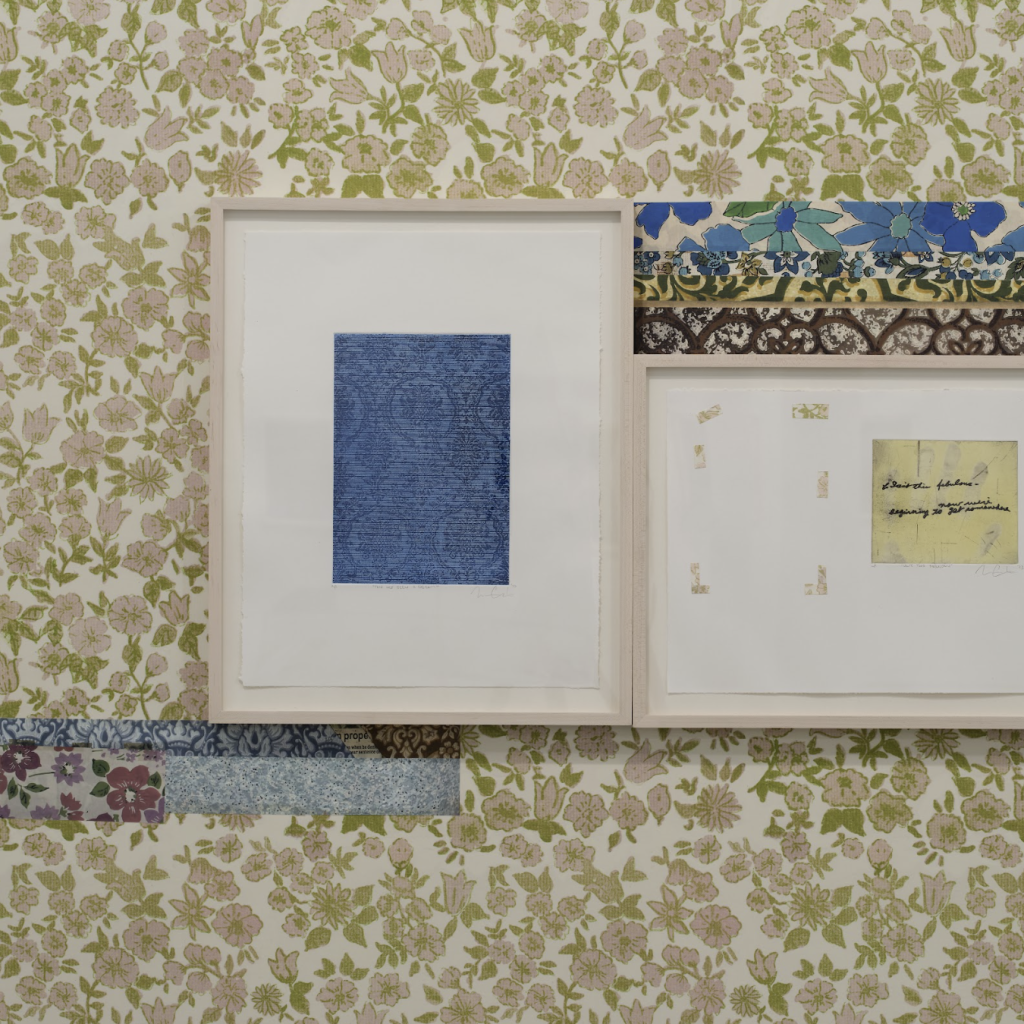 A photo frame with several different wallpaper fabrics